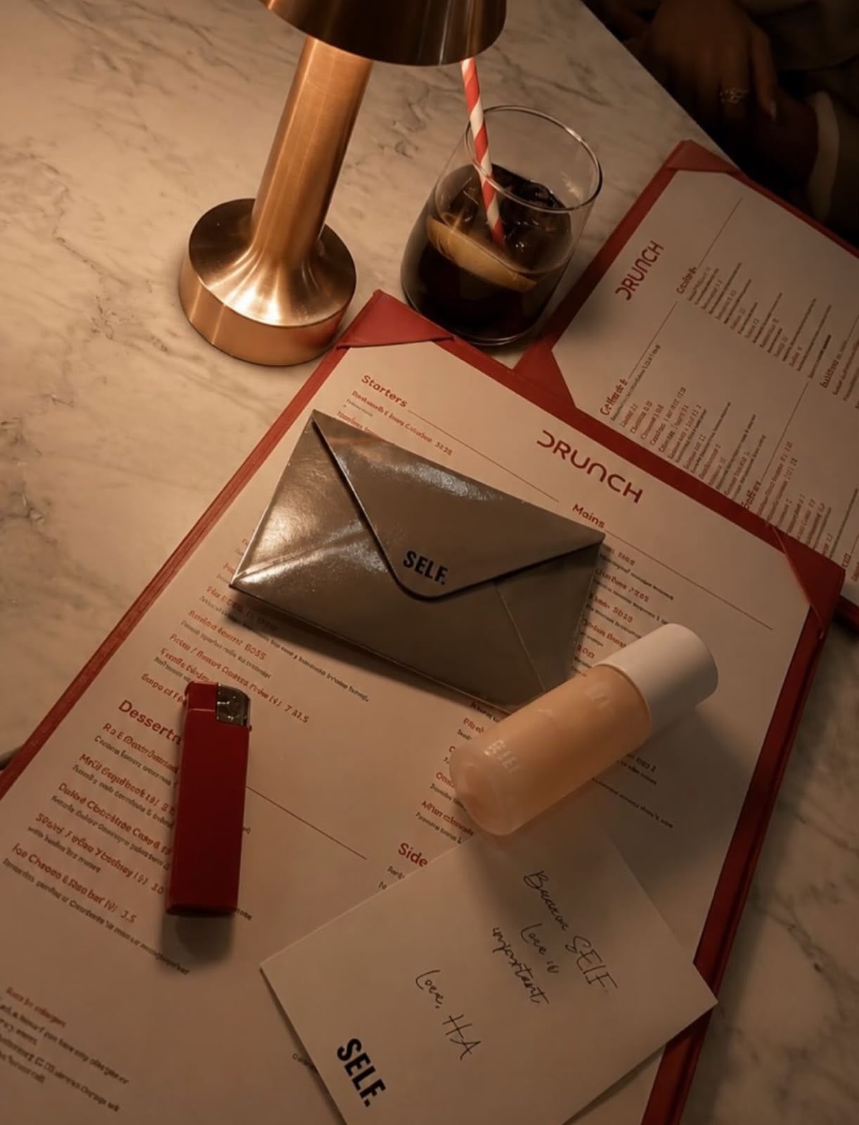 SELF. envelope and handwritten note on a restaurant menu