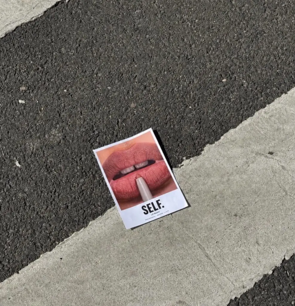 A SELF. poster on a Baghdad street